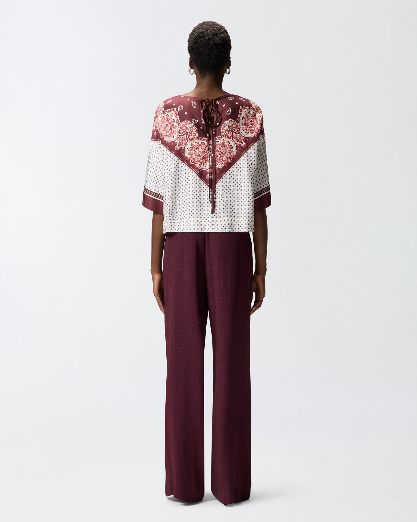 Blouse with tie motif and placed print