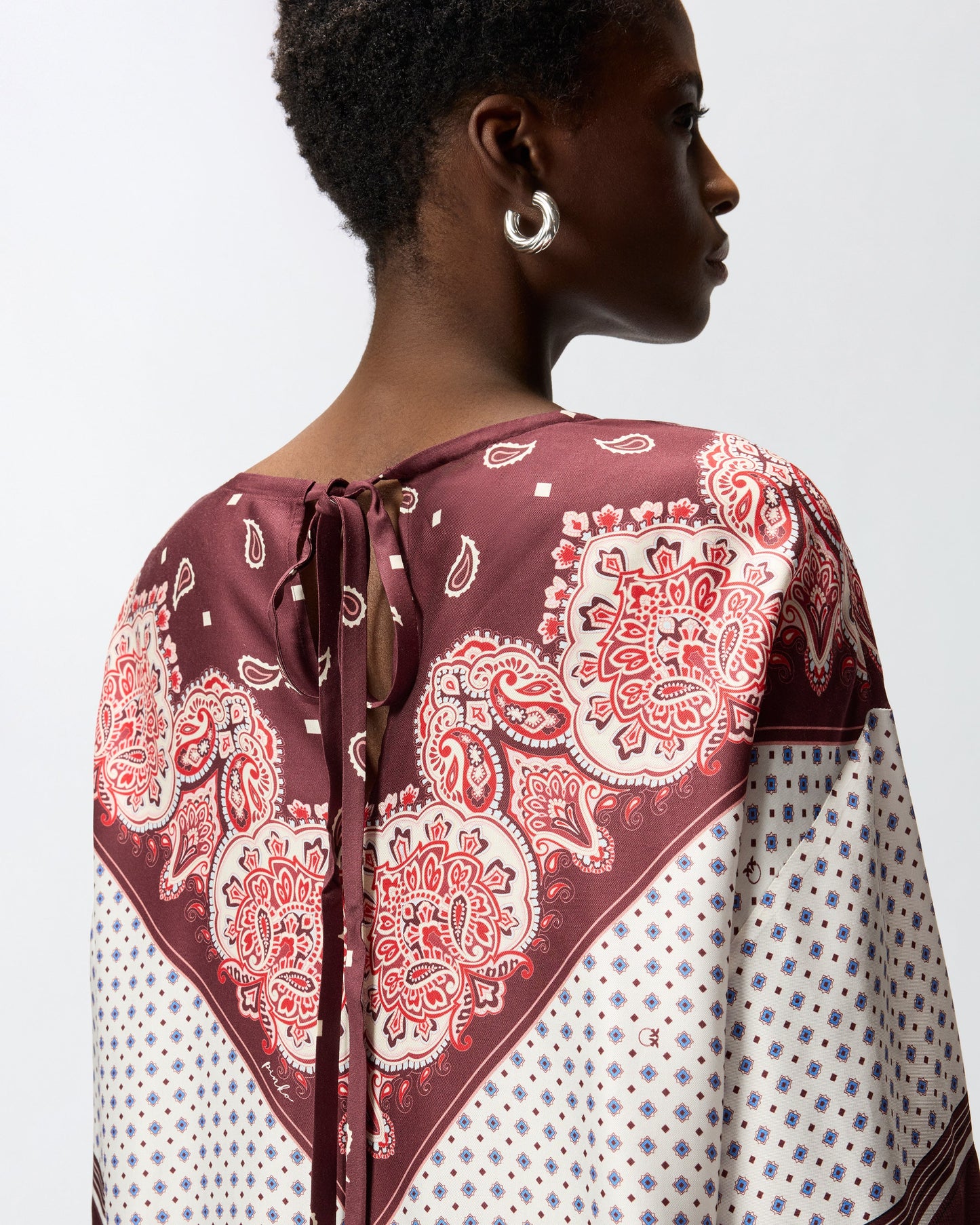 Blouse with tie motif and placed print