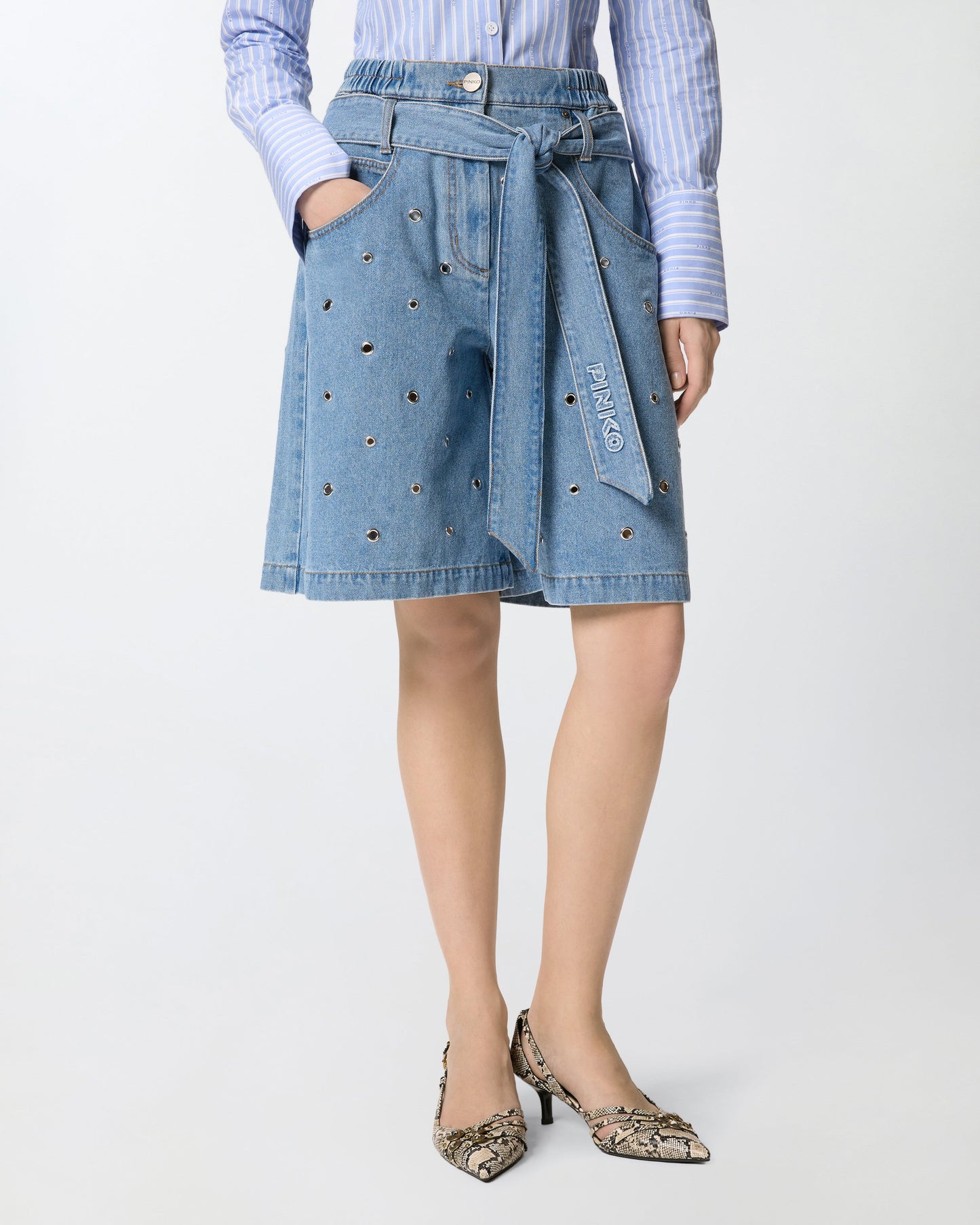 Denim shorts with eyelets and belt
