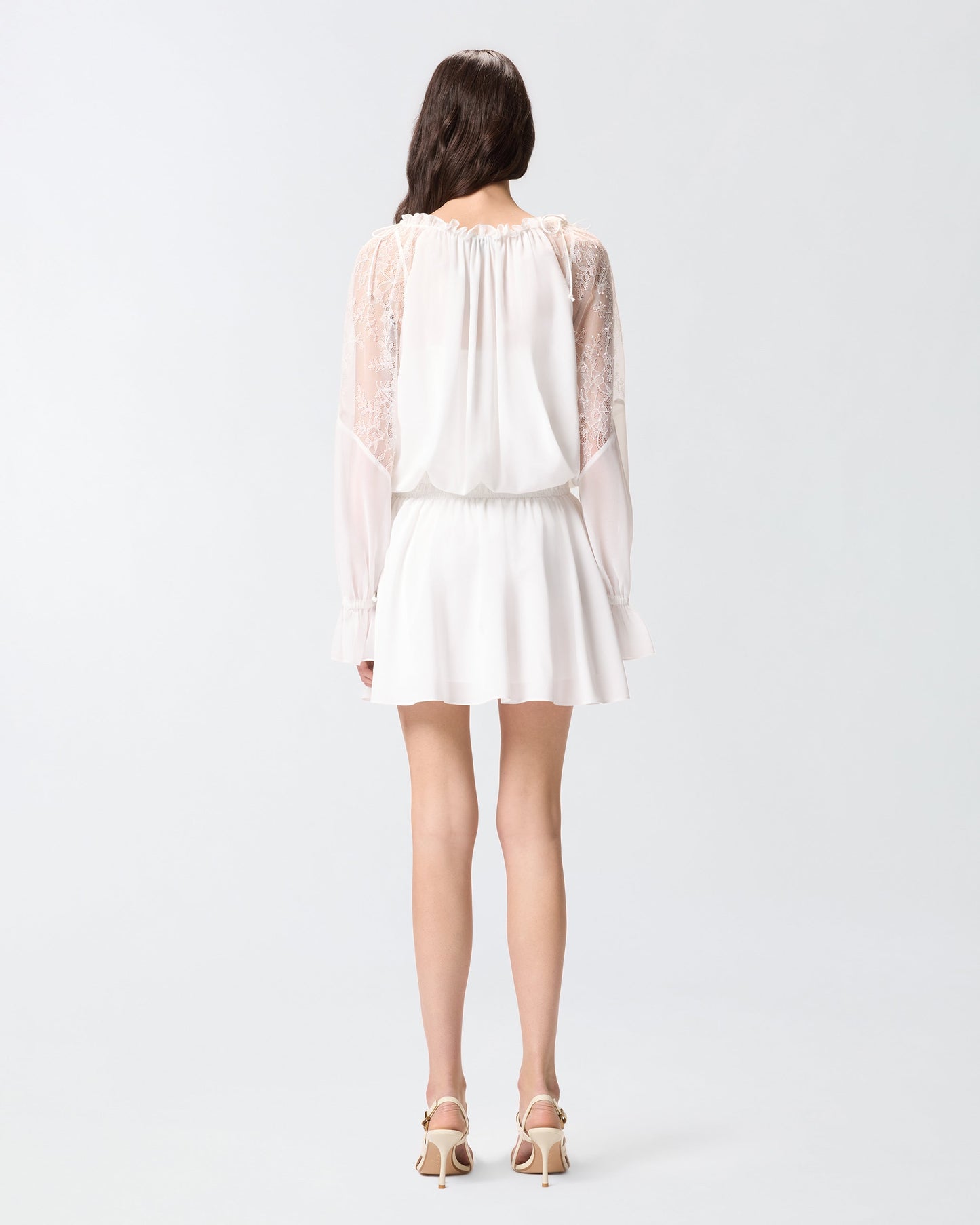 Mini dress with long sleeves and lace details