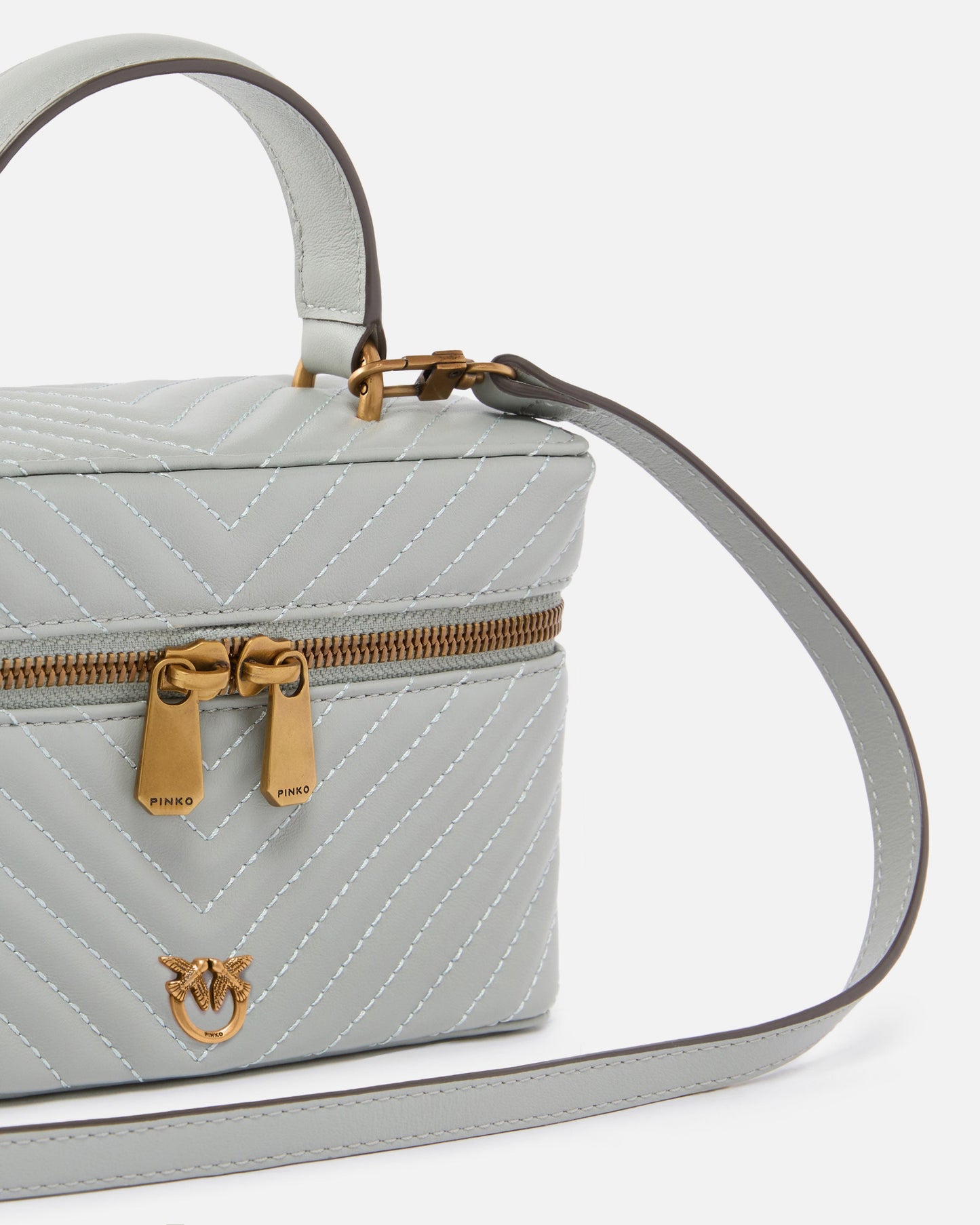 Small beauty case with shoulder strap in chevron nappa