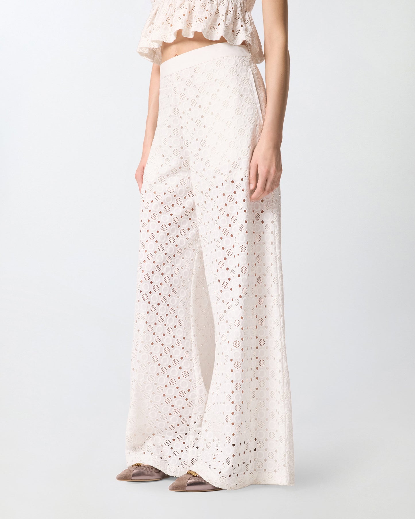 Trousers with openwork motif