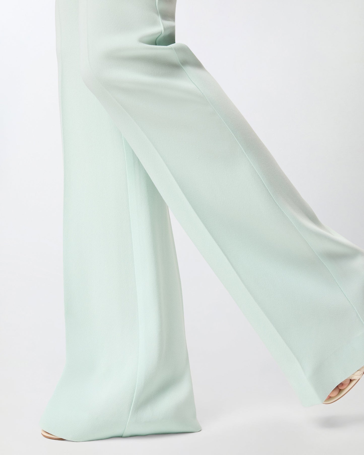 Flared trousers with pressed pleat detail