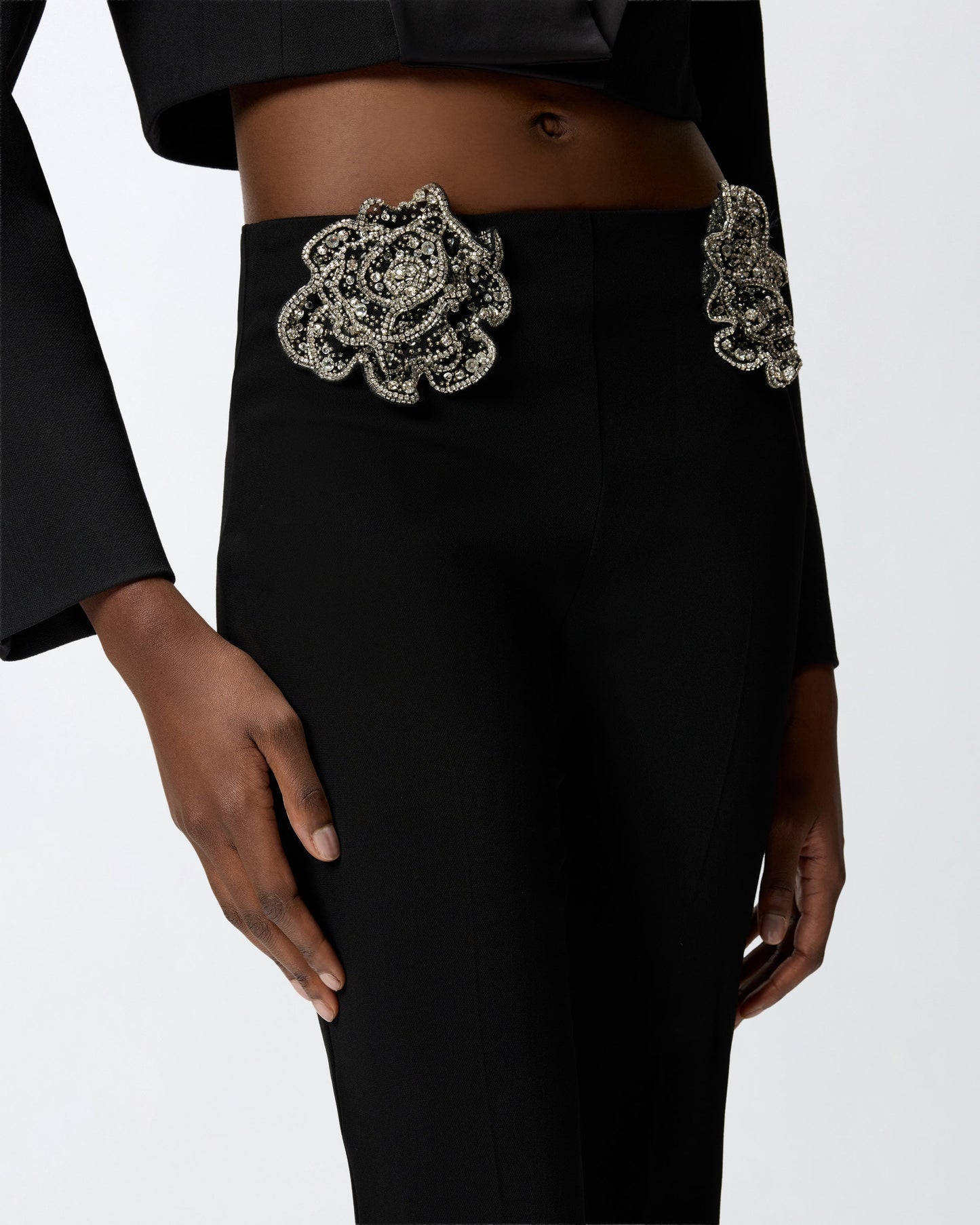 Trousers with embroidered jewel roses