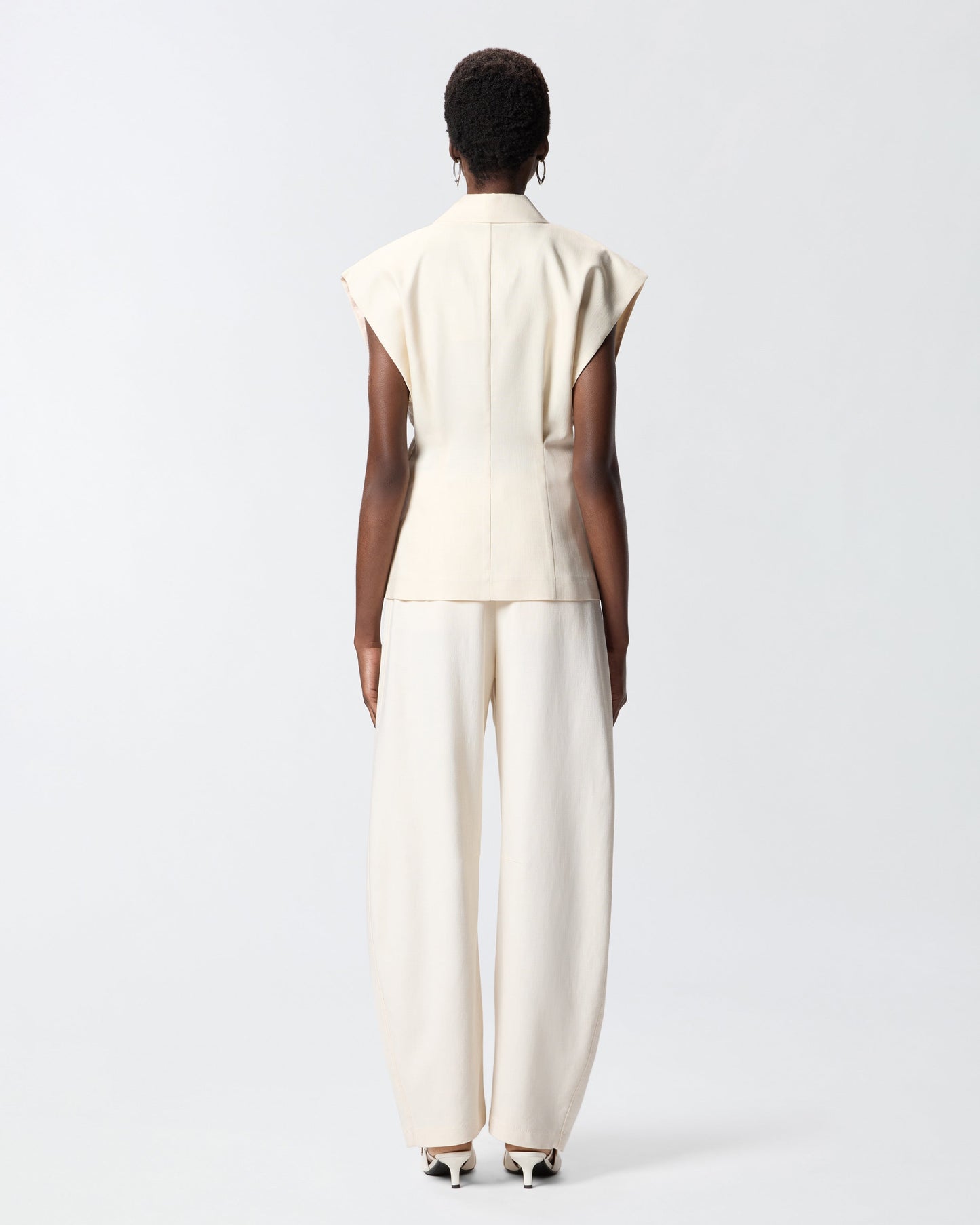 Sleeveless rustic-effect jacket