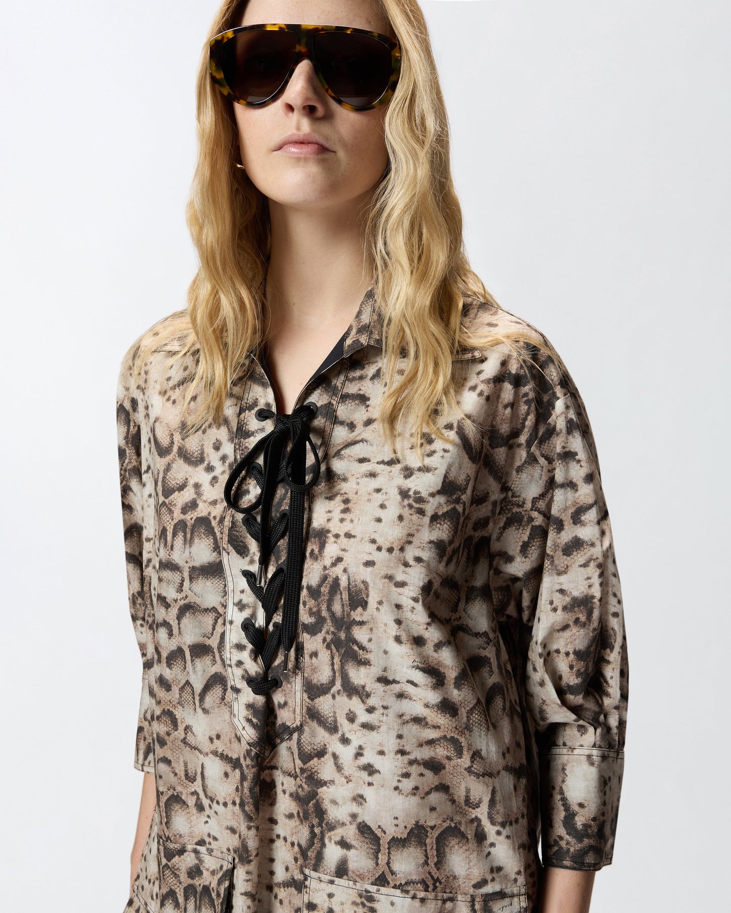 Mini dress with snake print and neckline ribbons
